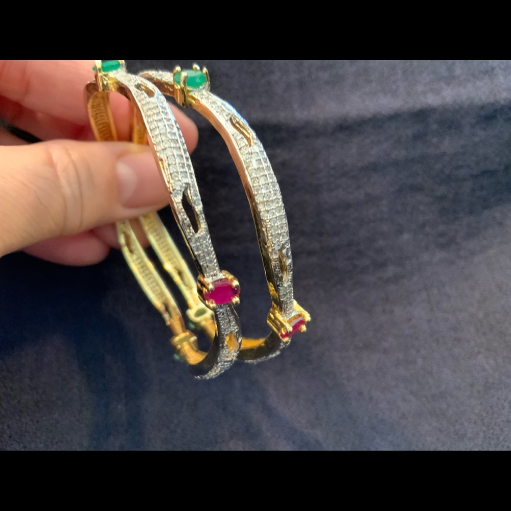 Imitation Ruby, emerald & diamond bangles in gold plated metal.look real.